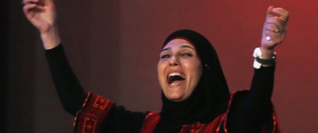 Palestinian primary school teacher Hanan al-Hroub reacts after she won the second annual Global Teacher Prize, in Dubai, United Arab Emirates, Sunday, March 13, 2016. Al-Hroub who encourages students to renounce violence won a $1 million prize for teaching excellence. (AP Photo/Kamran Jebreili)